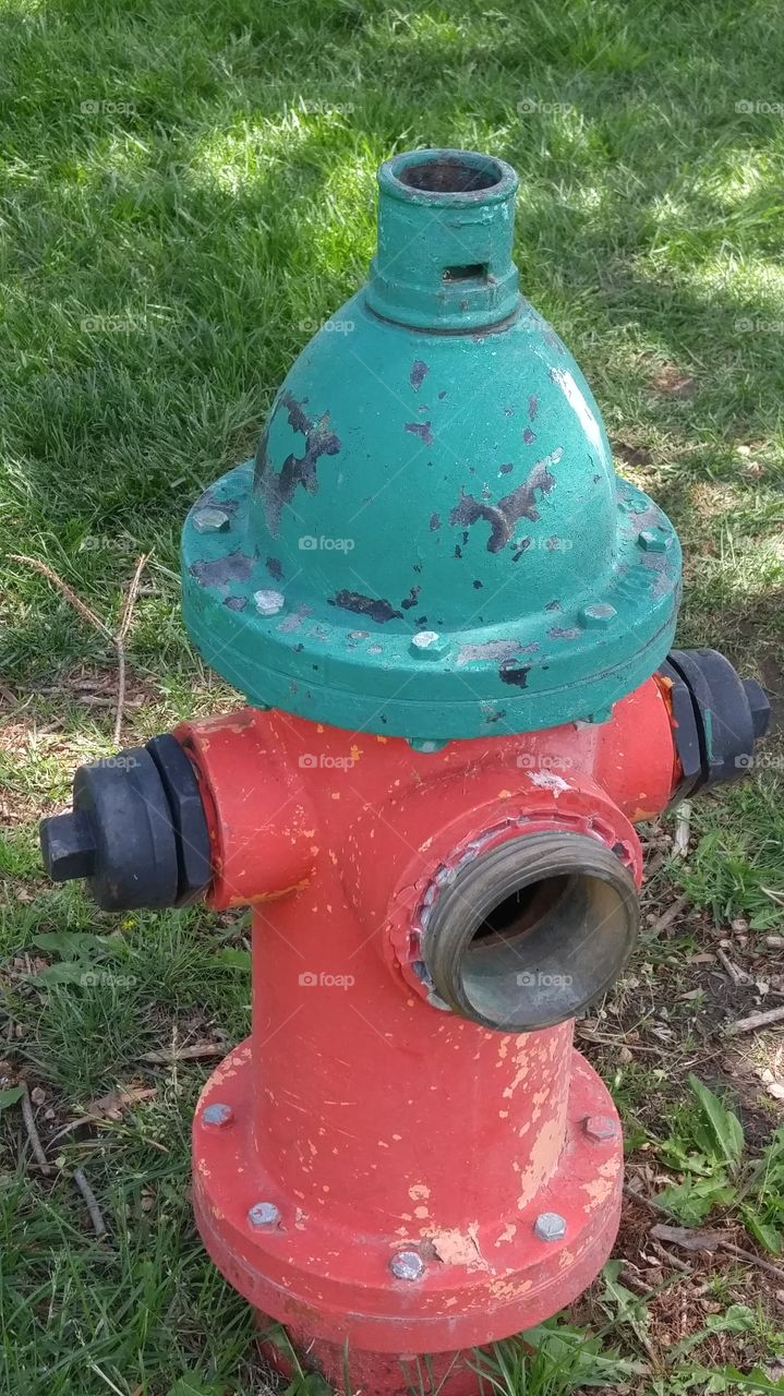 red, black and turquoise fire hydrant