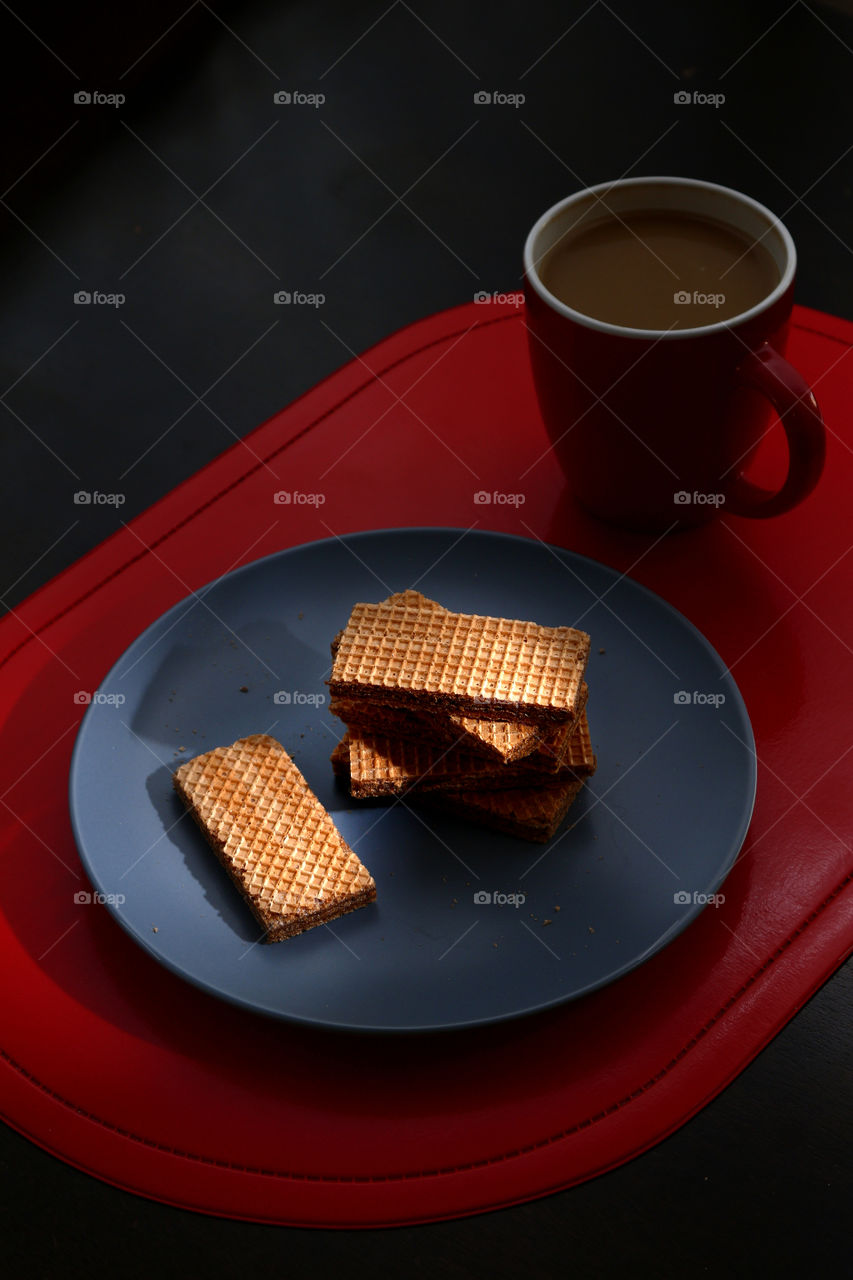 chocolate wafers and a mug of coffee