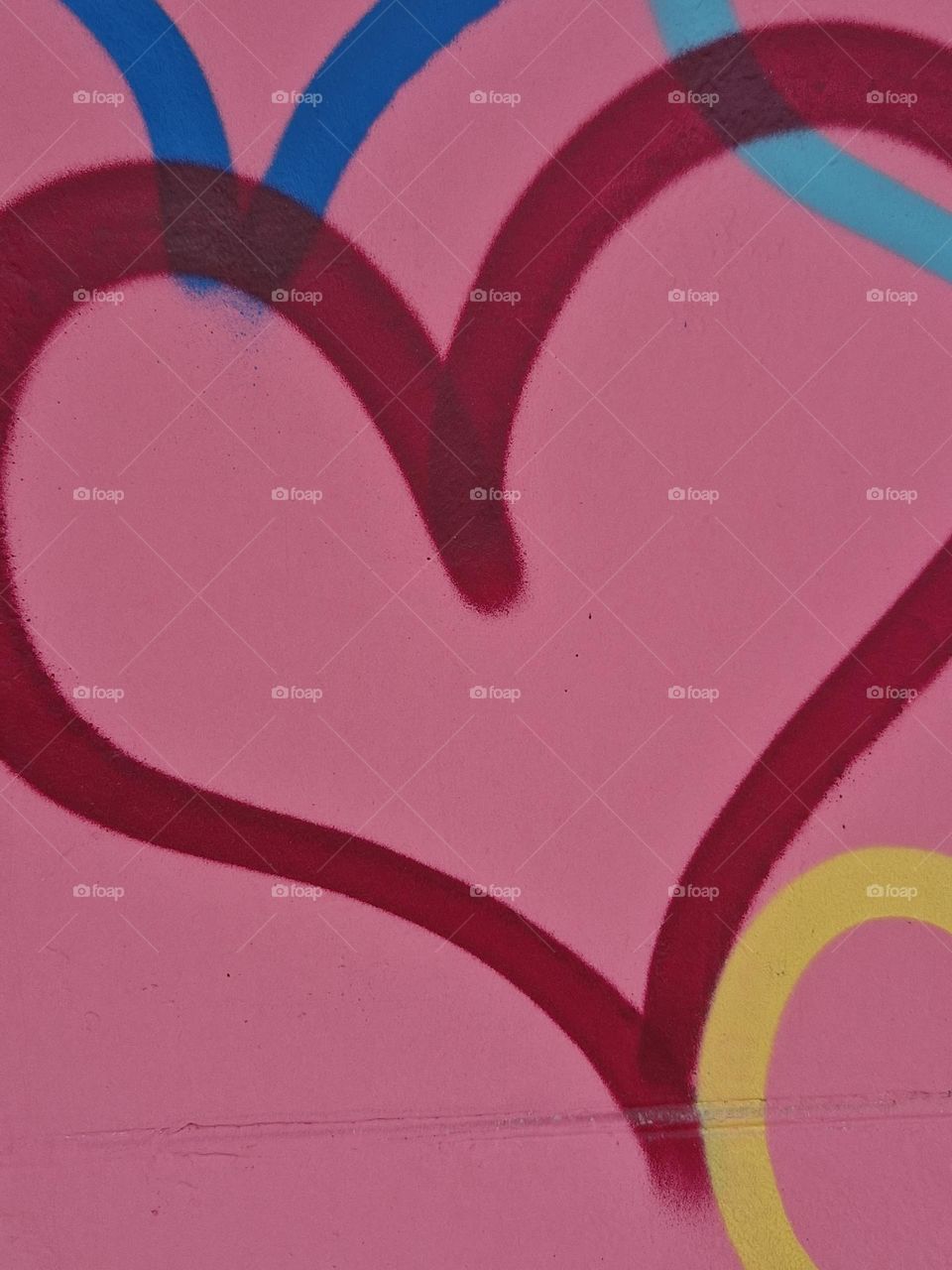 wall art outside restaurant heart