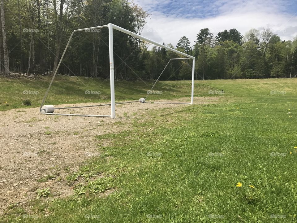 The Goal we want to achieve!, Sure it is going to be hard in life but we only have one life.
I took this picture on the top of a hill at my school it reminds me of my childhood and how I grew up with a soccer ball on my hands and my best friend by my side.