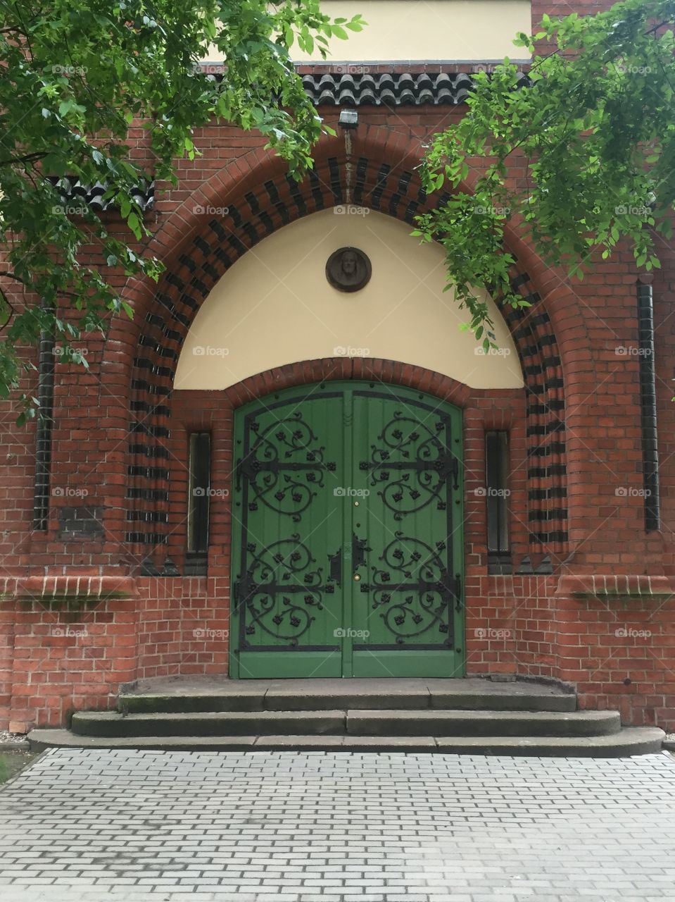 Green door of a Roman Catholic Church 