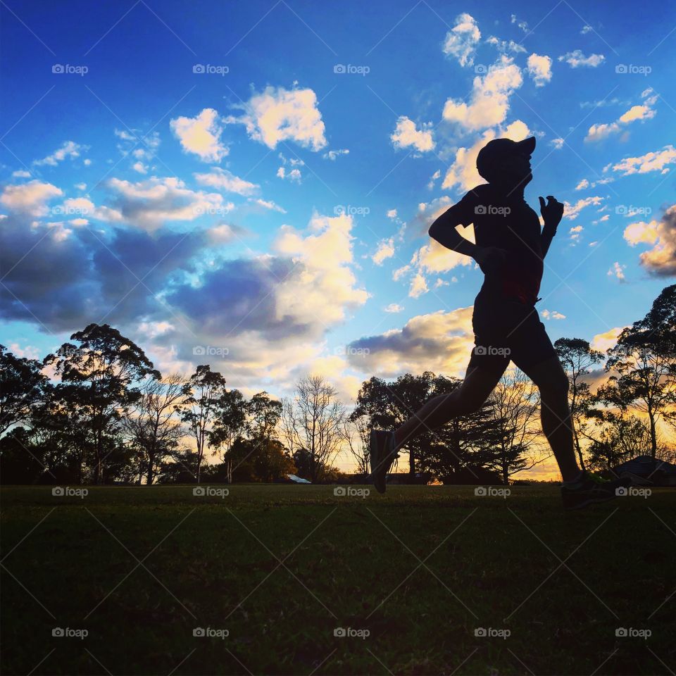 The runner running at sunset 