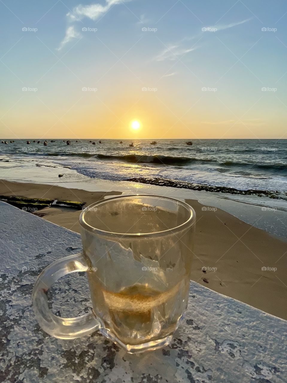 Coffee mug with sunrise and sea in the background