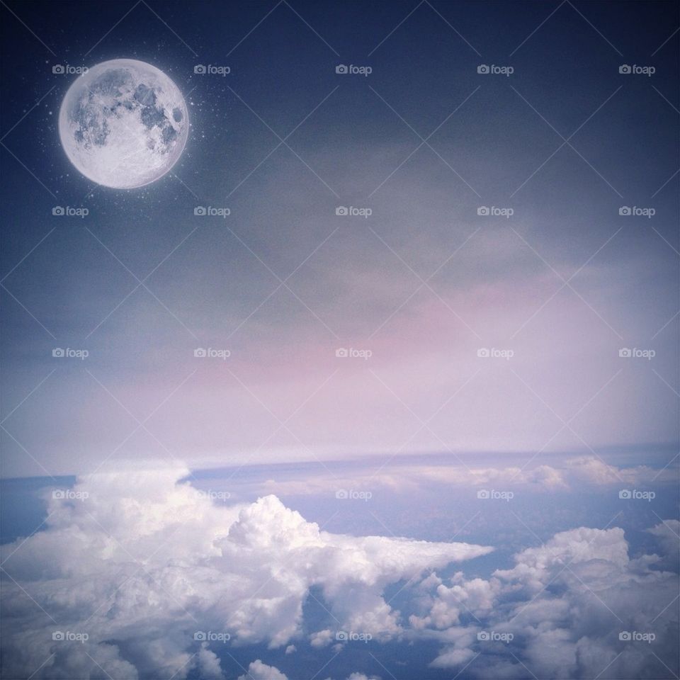View of full moon and clouds