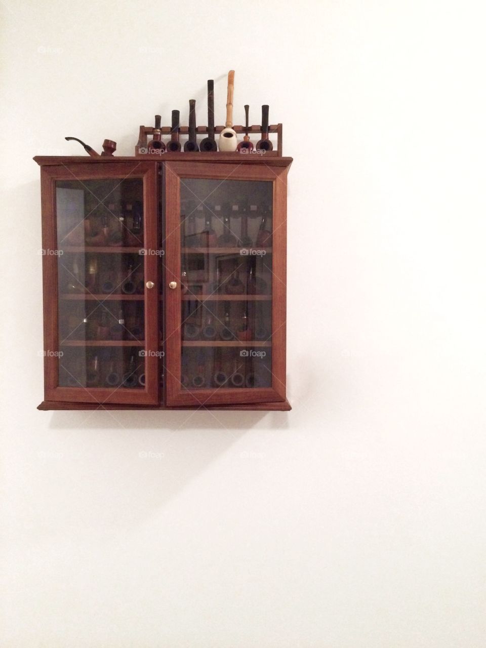 Display cabinet full of pipes