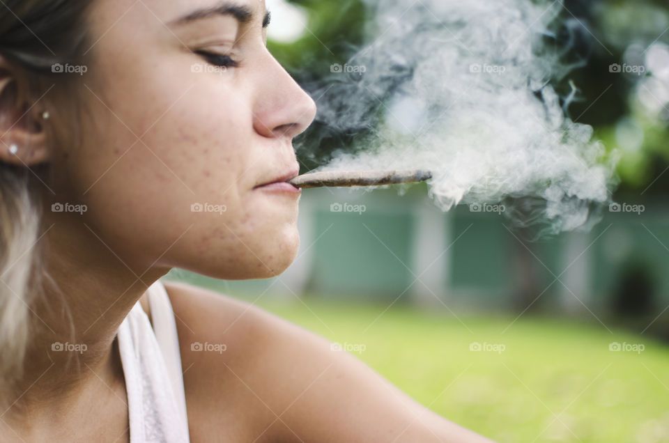Woman smoking a cannabis joint