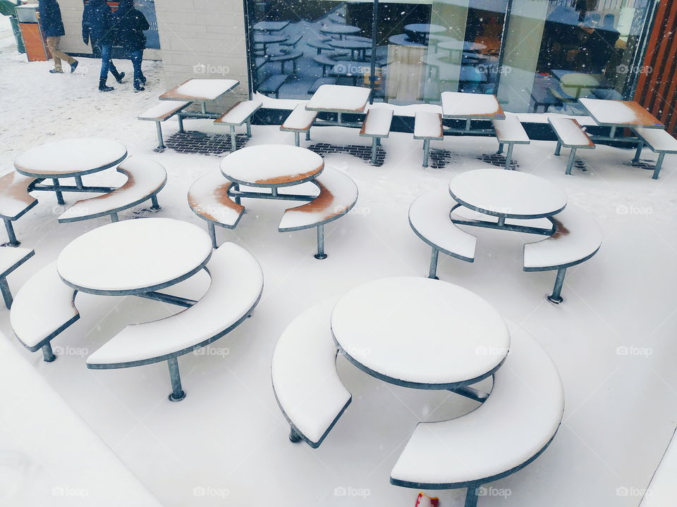 McDonalds tables in the snow in the city of Kiev