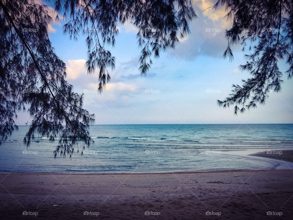 Romantic holiday vacation on tropical sandy beach seaside during sunset in southern Thailand - colorful ocean theme background