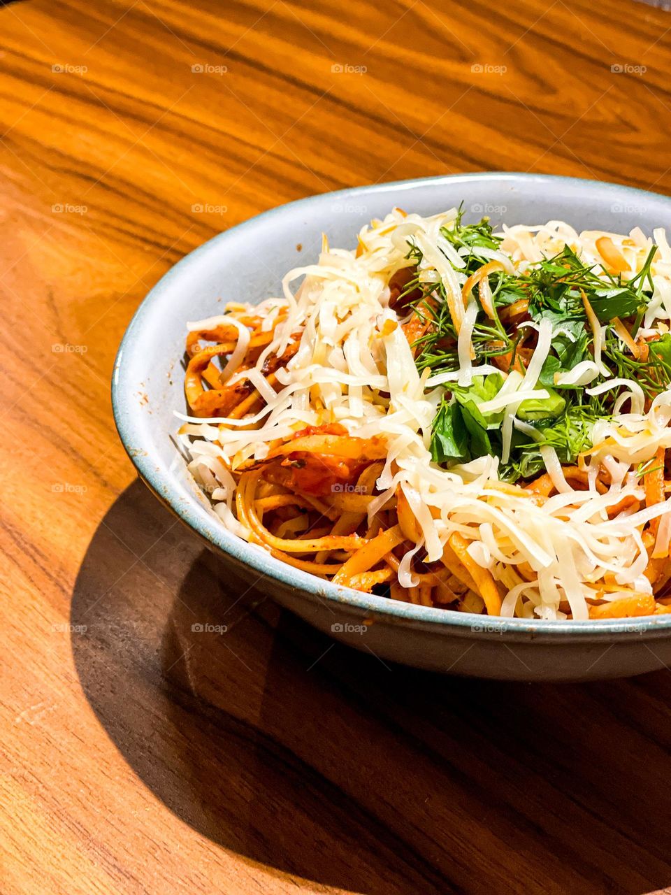 Linguine pasta with chicken and cheese on the plate home made