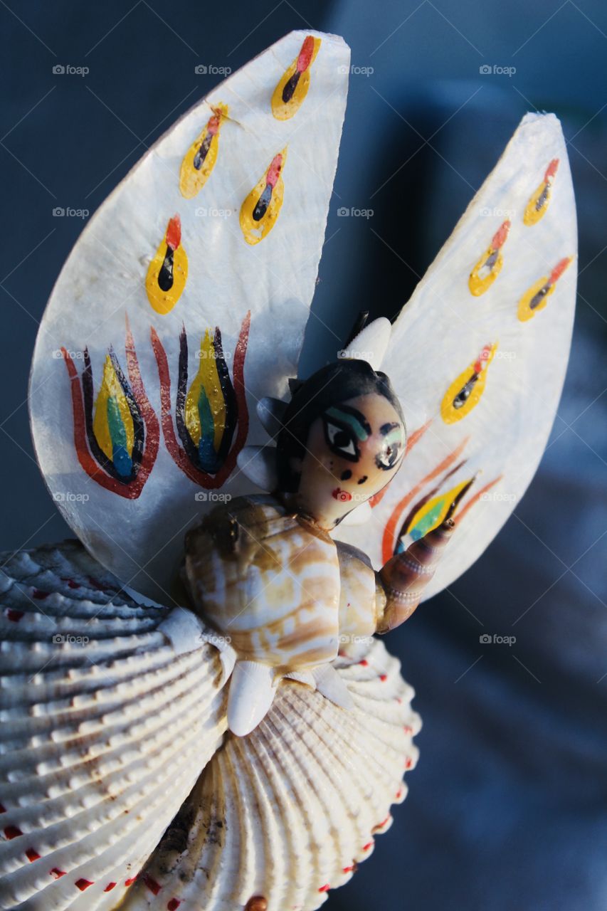 A Doll Made By Snail Shells ! 