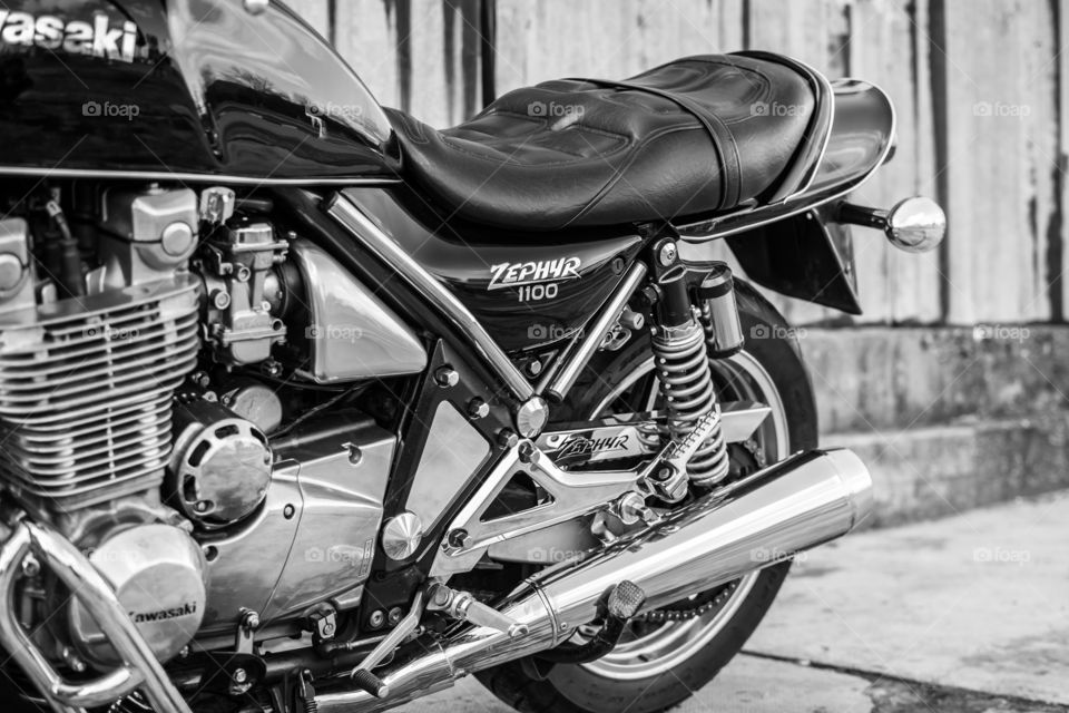 kawasaki zephyr motorcycle in front of the old rusty garage