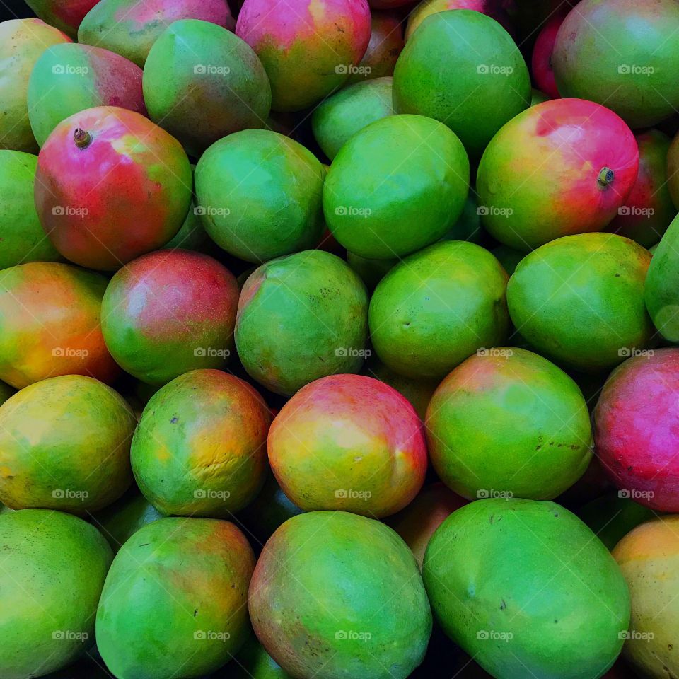 Beautiful,delicious,colorful Mangos at the fruit market.