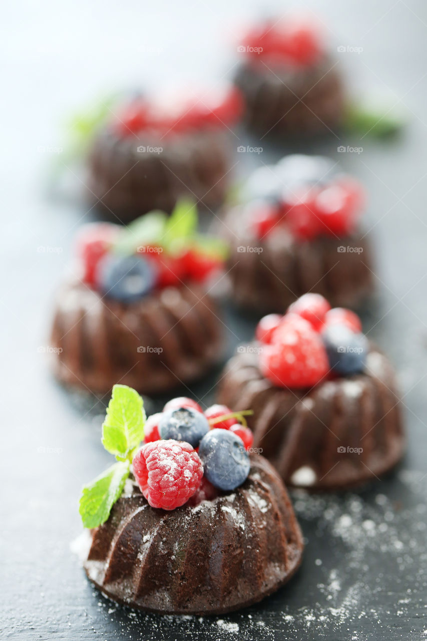Chocolate muffin, cupcake with berries