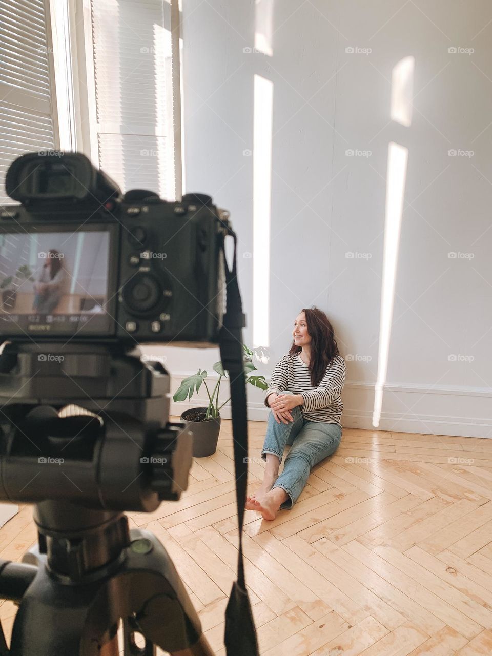 Young woman doing selfie portrait on camera 