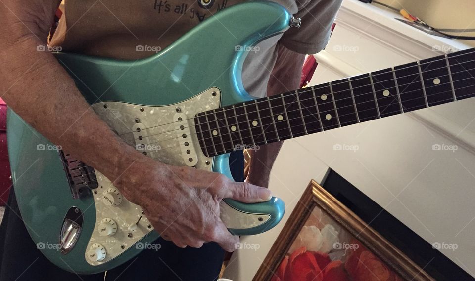 Blue Fender guitar. 