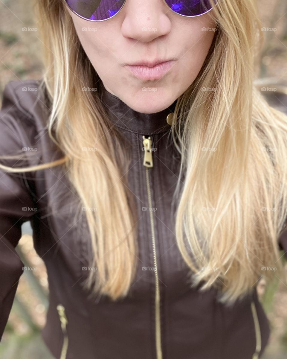 Purple Funk sunglasses and a plant leather jacket