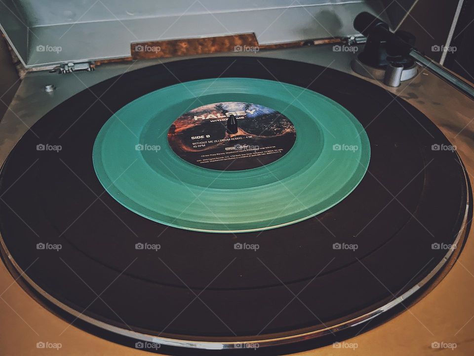 Halsey record on record player, circular record playing on stereo, 45 record playing on record player, albums in the new era, cool colored albums, geometric shapes in every day life 