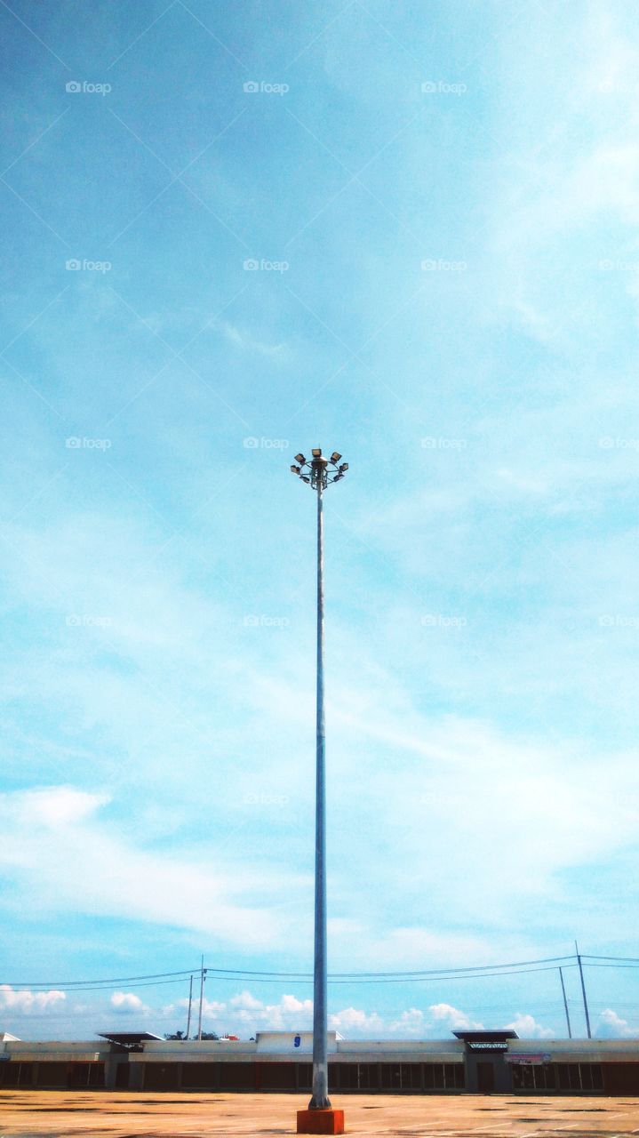 One lamp post with blue sky background