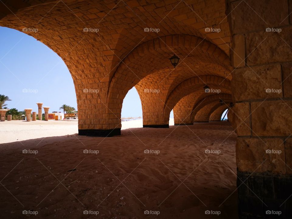 A beautiful bridge construction (like tunnel) on the beach