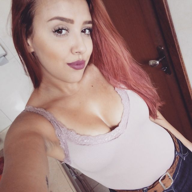 Portrait of young woman taking selfie