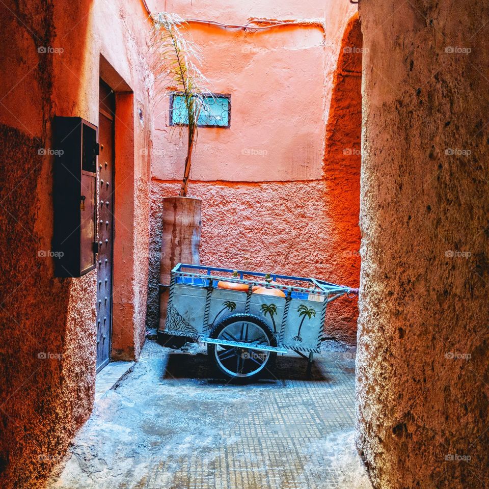 Stored decorated cart at the end of a narrow street in the Medina of Marrakech