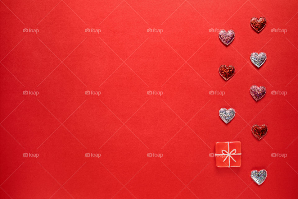 Red hearts on a red background. Valentine's Day.