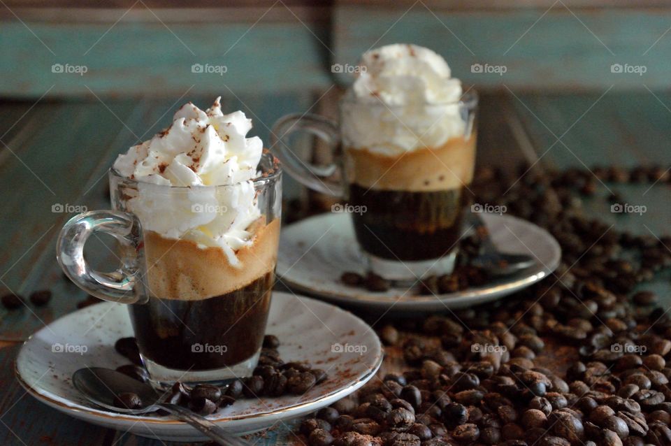 Ice cream coffee with coffee beans on table