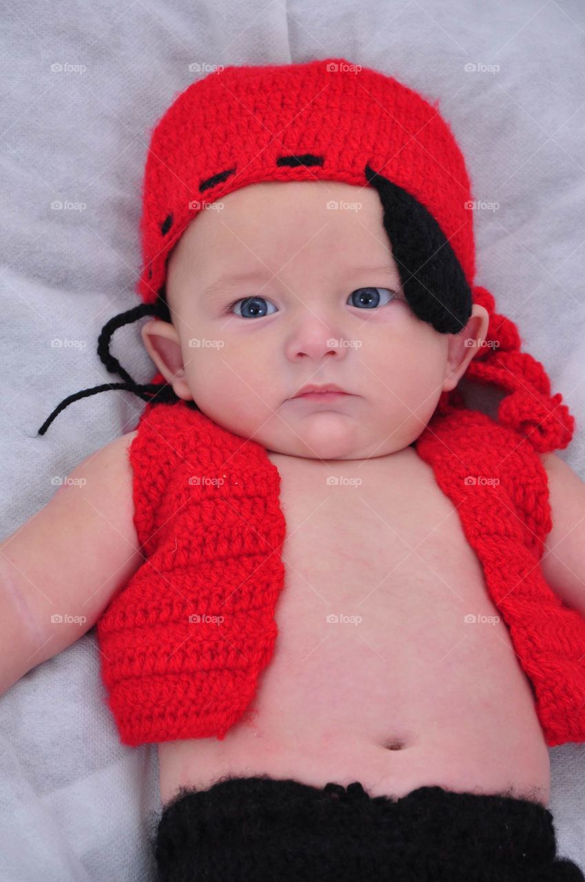 baby in red pirate outfit