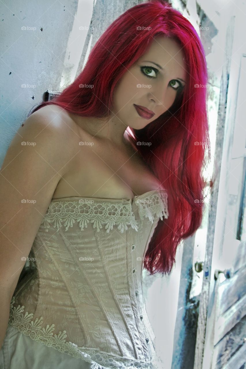 Portrait of gorgeous sensual woman with red dyed hair