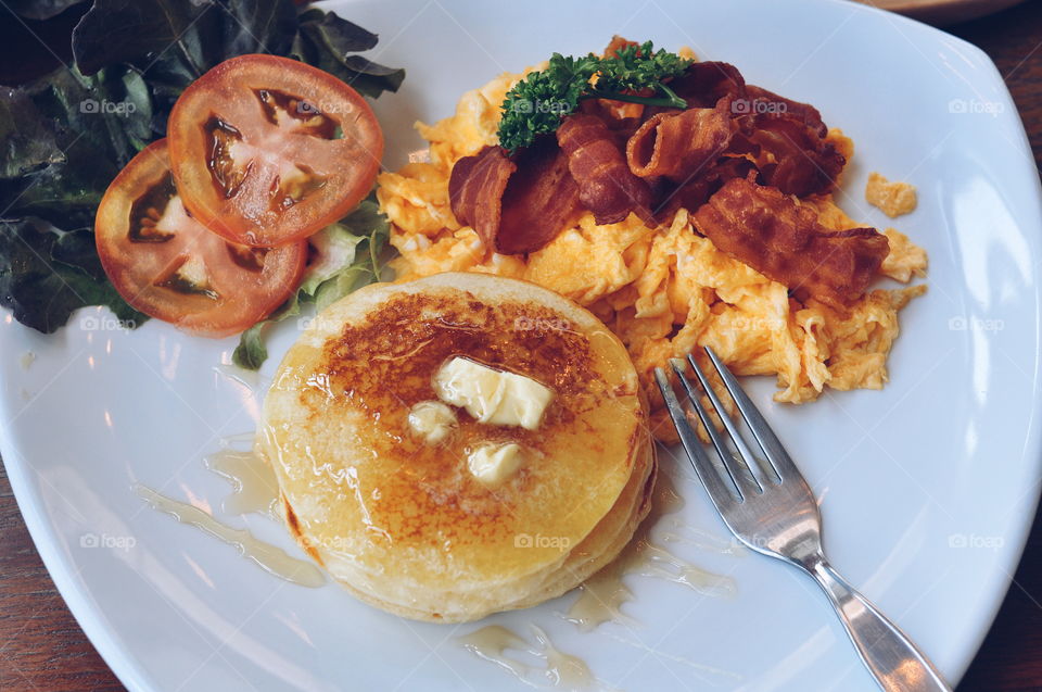 Good Breakfast. Stacks of pancakes, bacon, eggs for good morning startup!