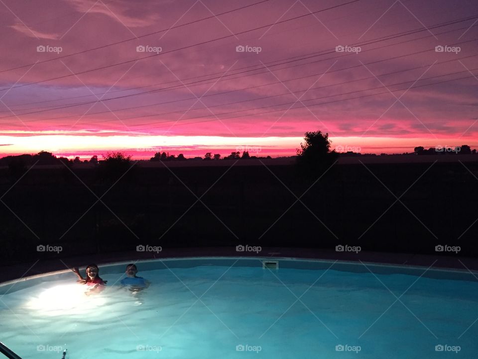 Pink sky  dusk swimming pool 