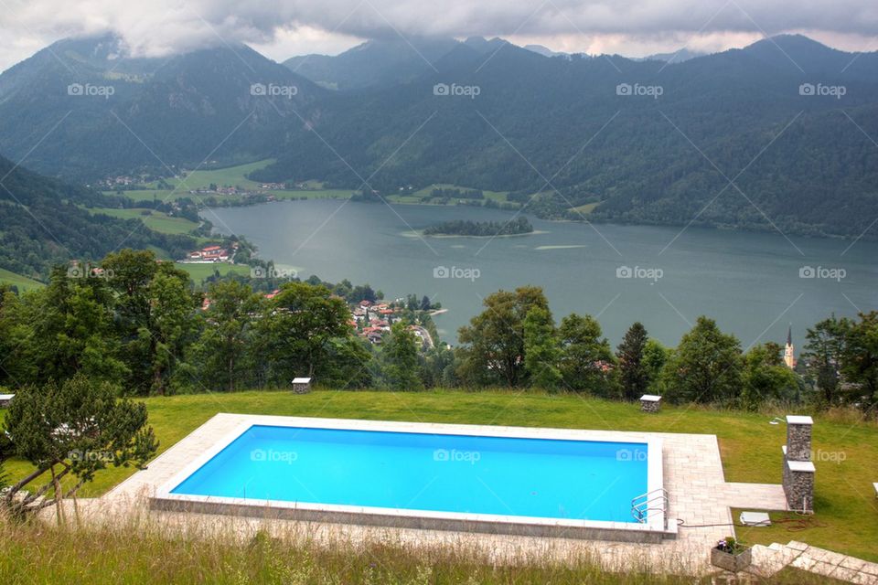 View of blue swimming pool near the lake