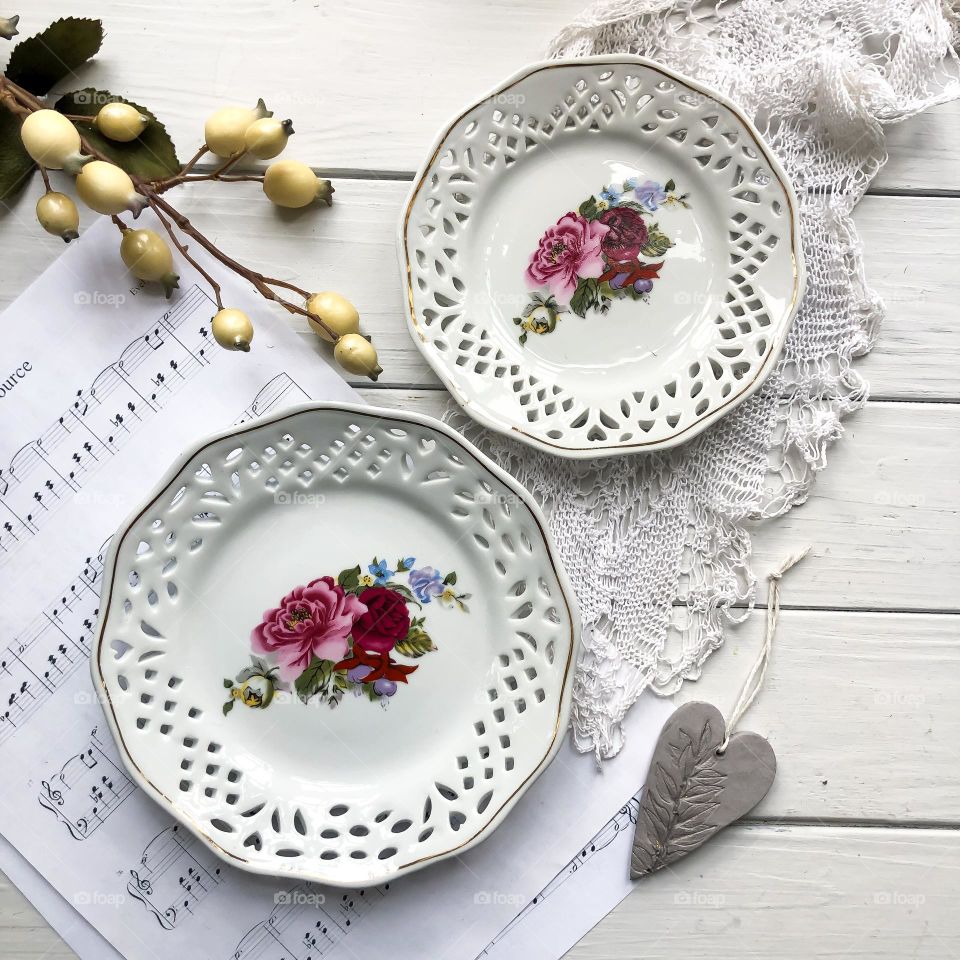 Vintage plates with through openwork pattern and flowers ornament