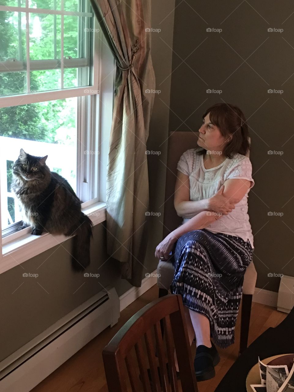 Pensive woman with cat