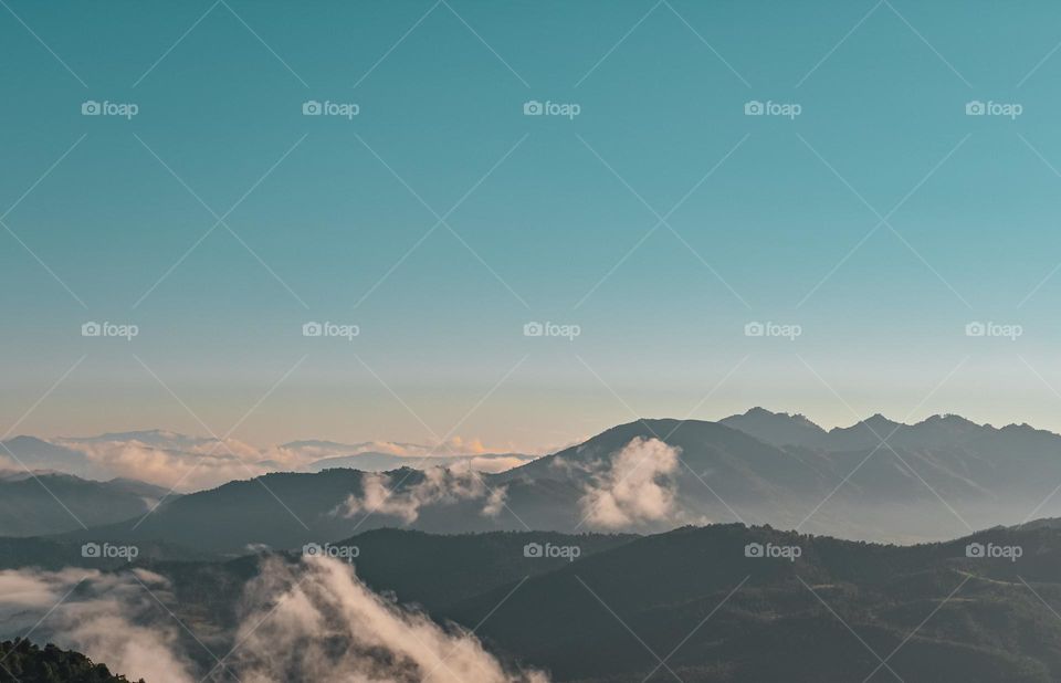 Mountain range covered with clouds.