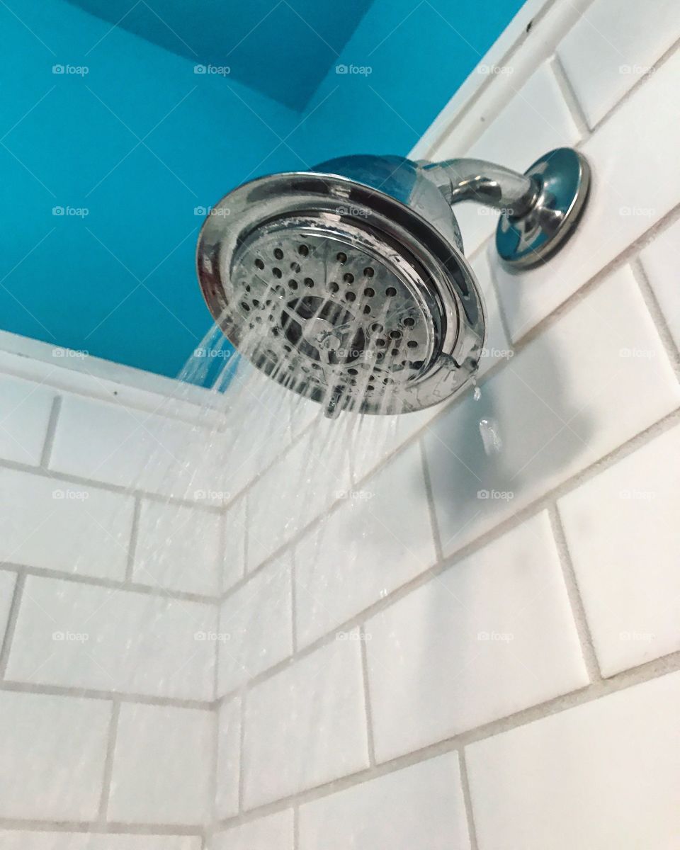 Water coming out of a shower head 