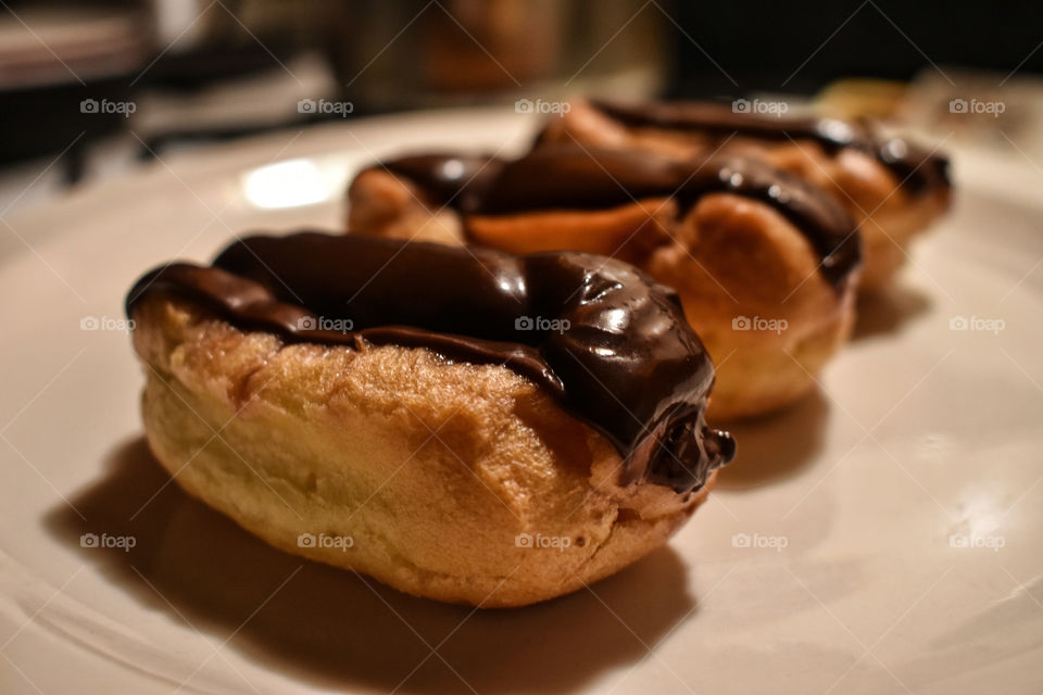Traditional French Chocolate Eclairs With Chocolate Ganache Closeup