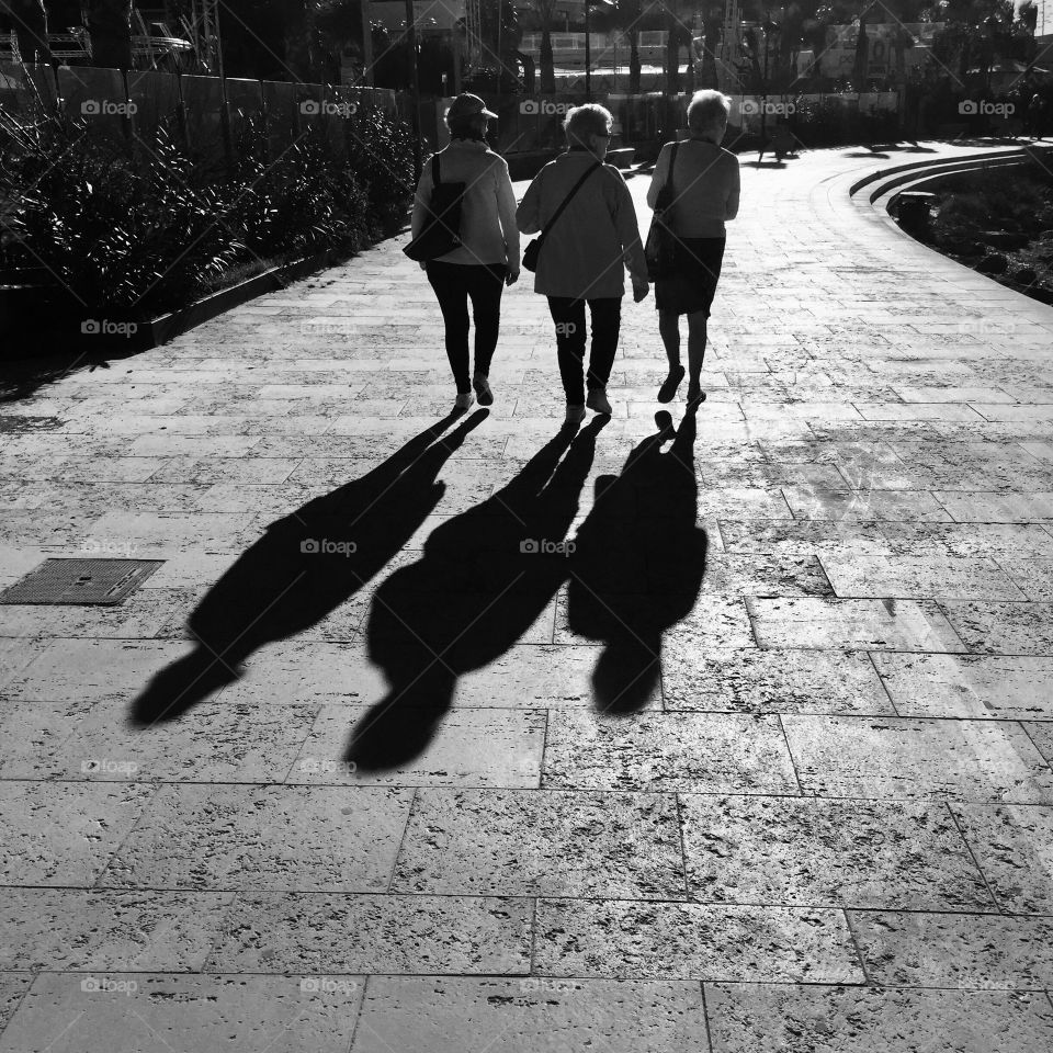 Silhouettes of 3 elderly ladies 