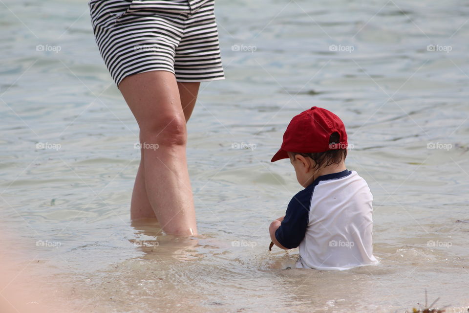 Boy in the Ocean with Mother 