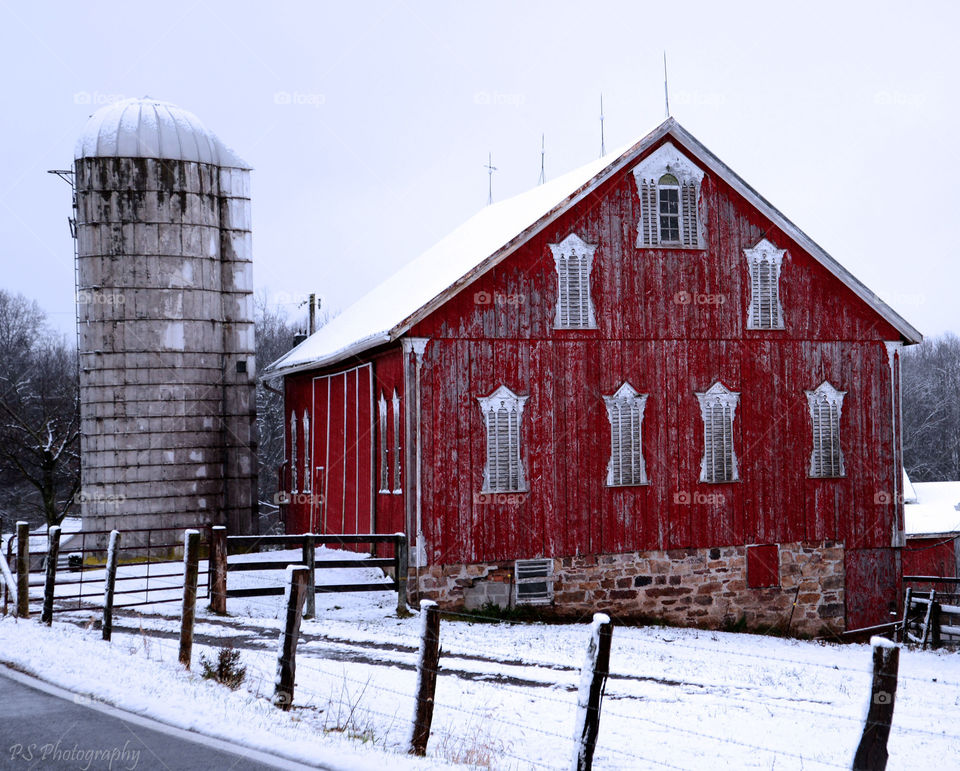 old red barn. Snow covered old barn