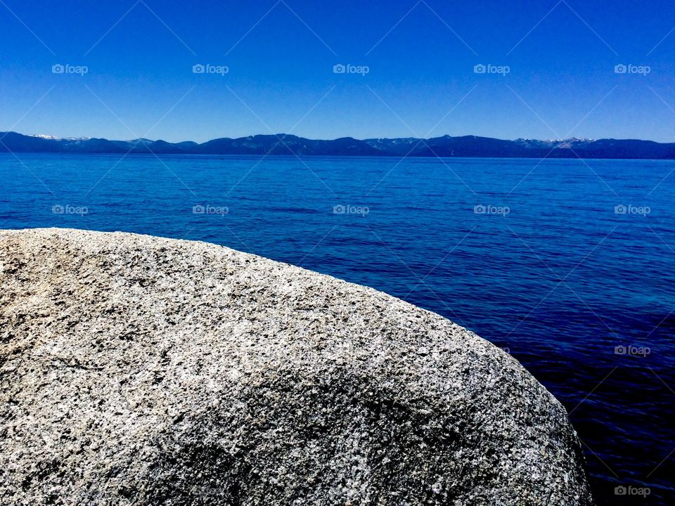 View of rough rock against seascape