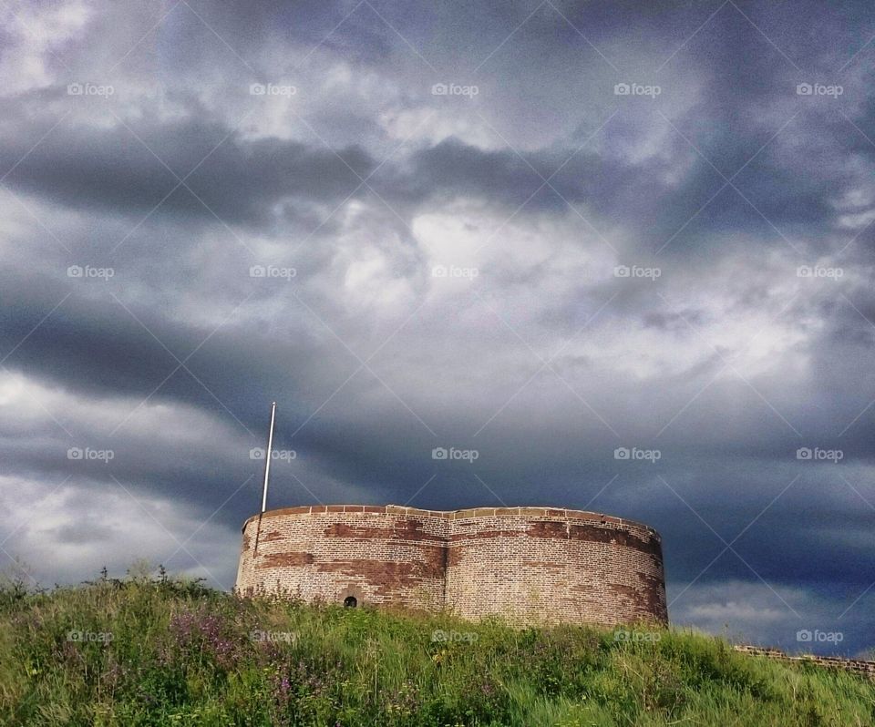 Martello Tower Against Angry Sky