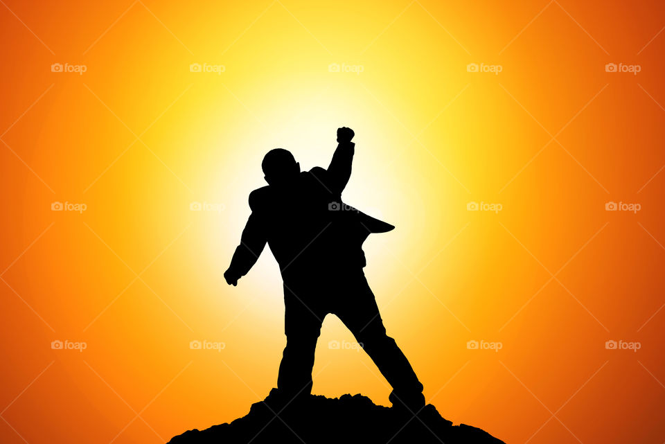 Silhouette of Businessman Celebration Success Happiness on a mountain top. Business, achievement, success, concept