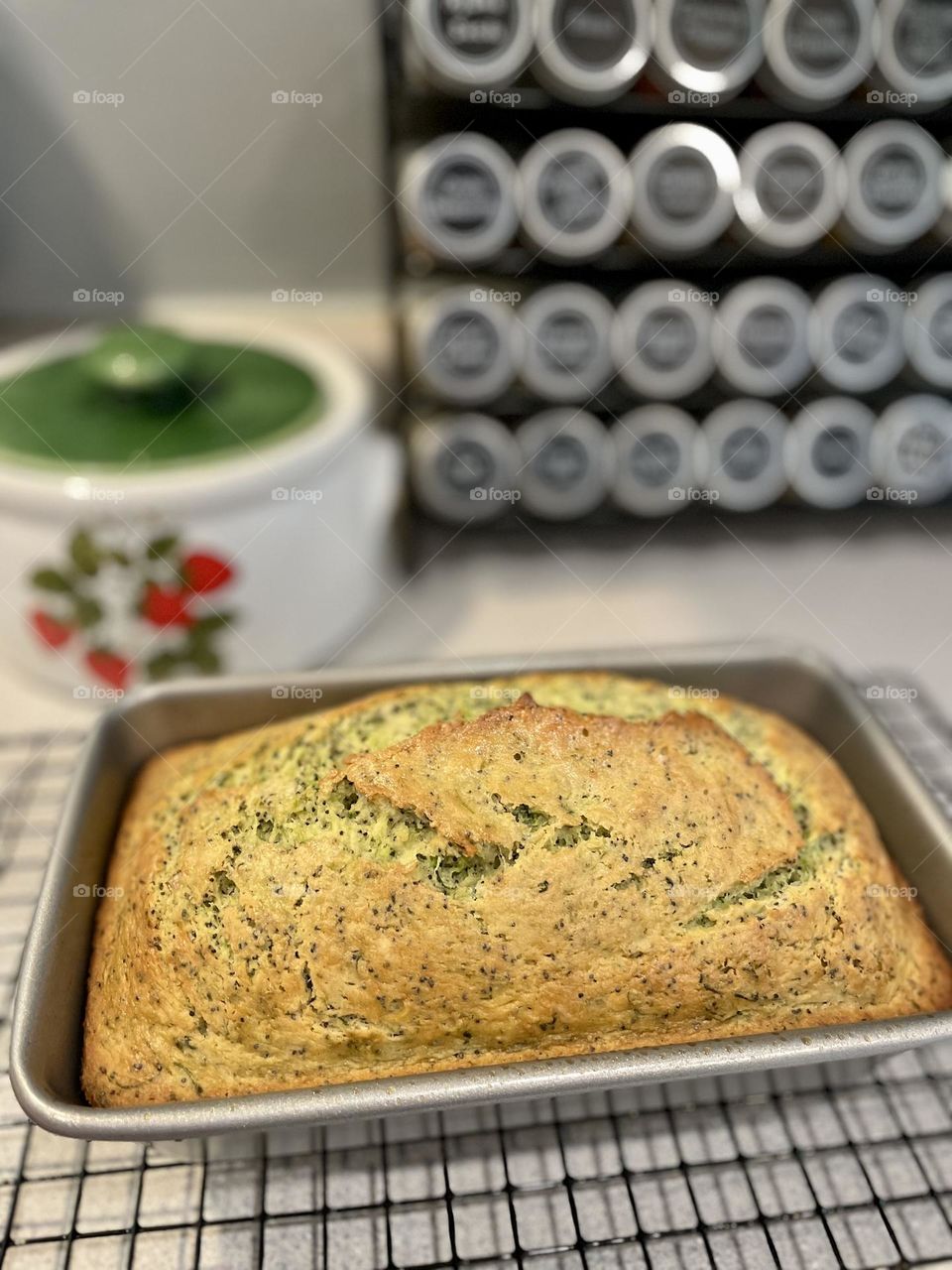 Fresh baked bread cooking on the counter, fresh baked lemon poppyseed zucchini bread, making homemade breads, baking with vegetables 