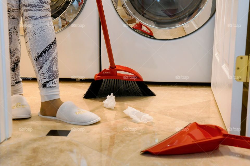 Sweeping the laundry room