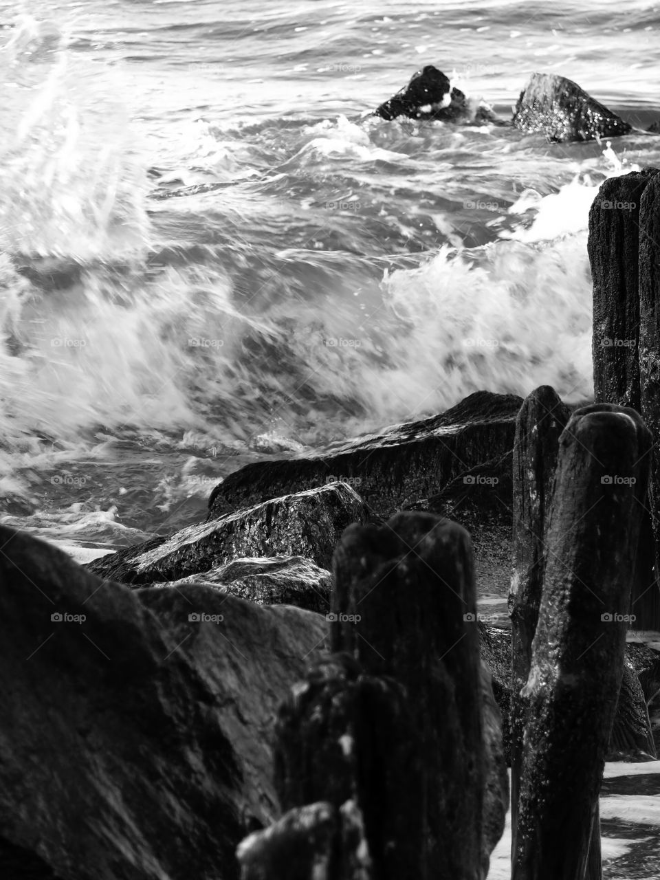 Black and white close-up of sea waves motion at the beach in Niechorze, Poland.