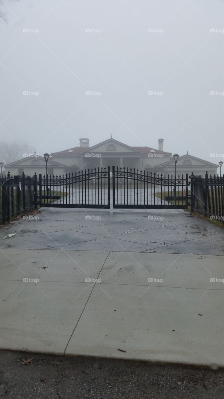 mansion on coast of foggy  Lake erie in Cleveland Ohio