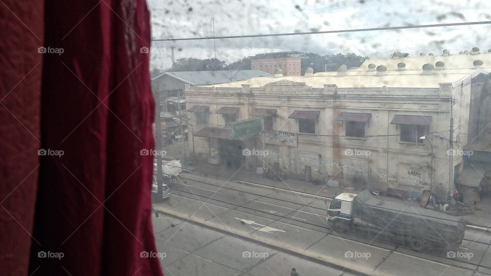 Here's a picture of a dirty window which shows the urban part of cebu city, Philippines.