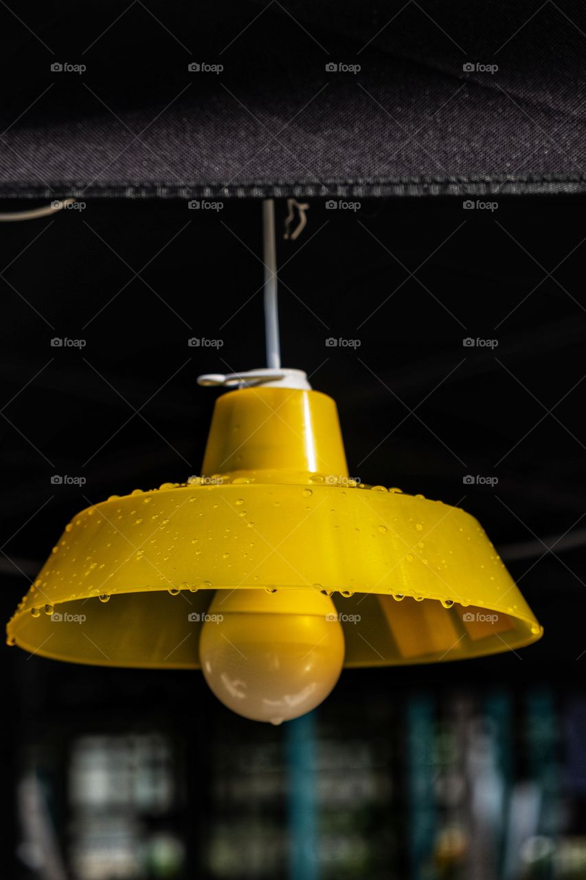 Water droplets on the yellow lantern