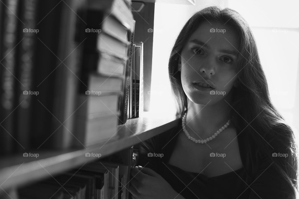 Beautiful girl with pearl necklace for recreation